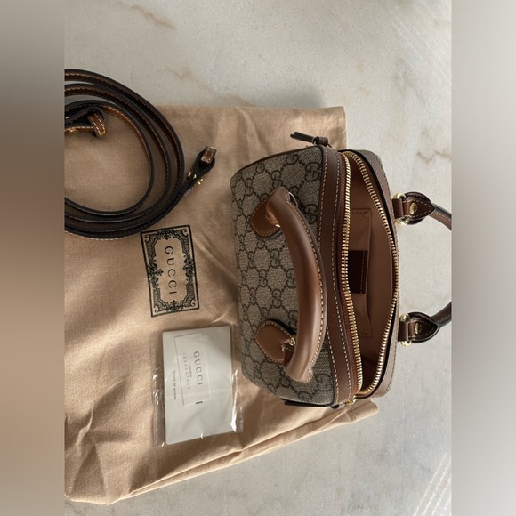 Gucci mini top handle bag. Like new- perfect condition. 
Dust bag included - Picture 3 of 7